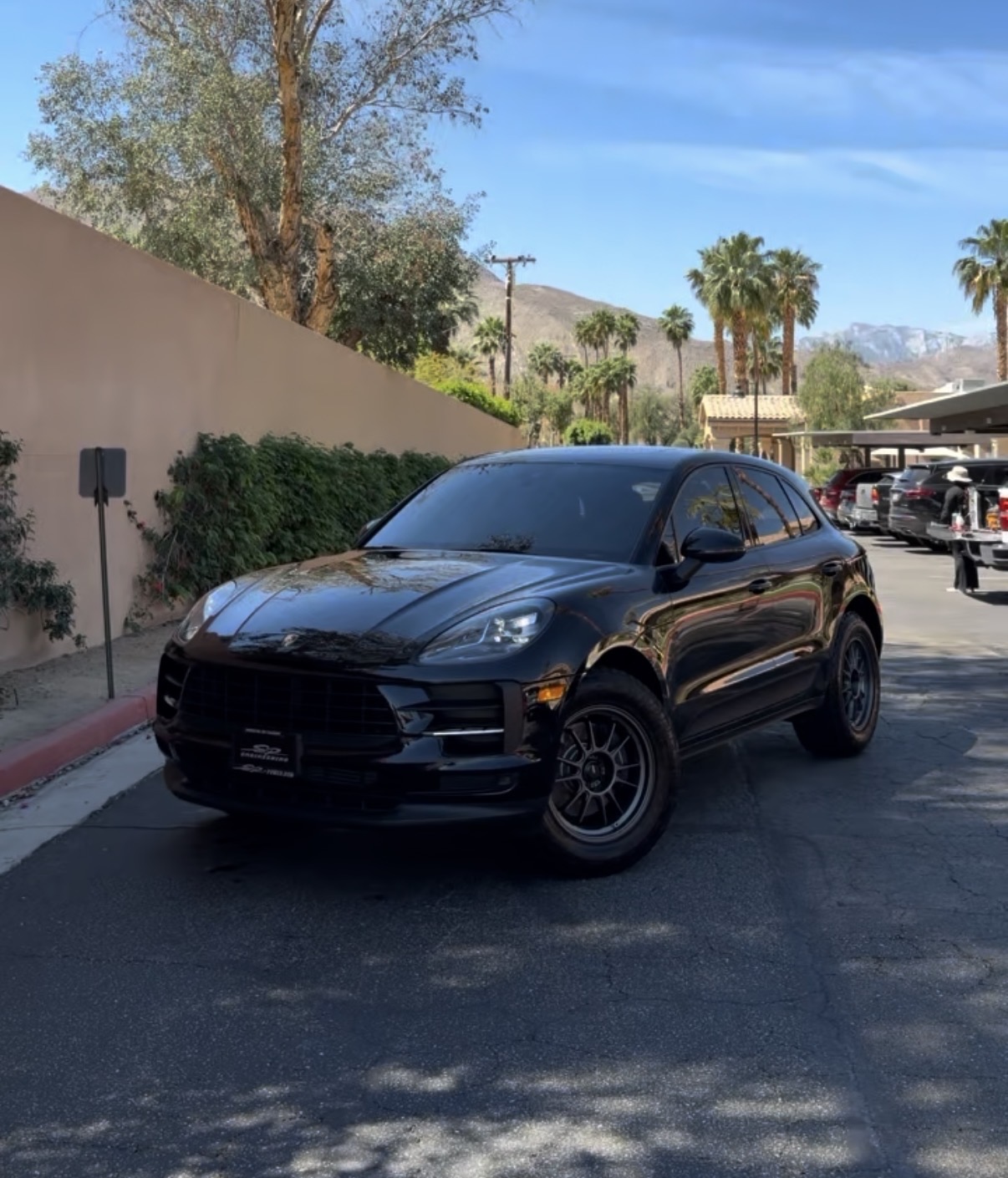 Freshly detailed black Porsche Macan with a mirror-gloss finish